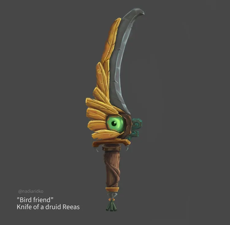 a knife with golden feathers as a decoration and a green chrome eye on the center